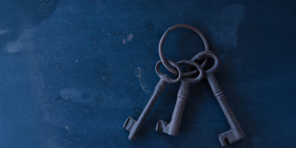 Ring of three old metal keys